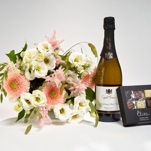 Valentinsdagsblomster, bobler og chokolade