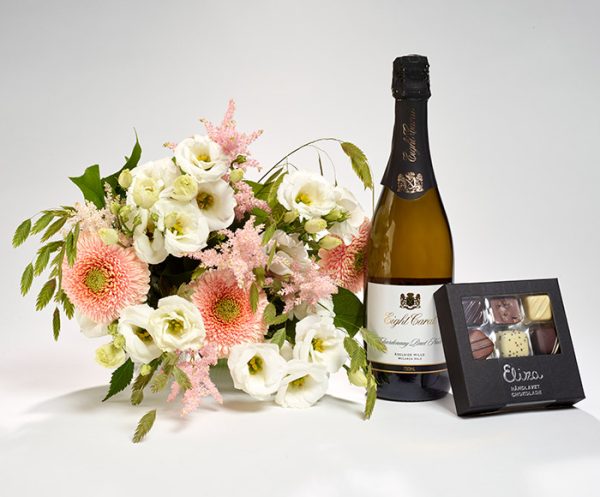 Valentinsdagsblomster, bobler og chokolade